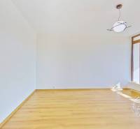 Furnishing an empty room with a light wooden floor surface in a 4-room apartment.