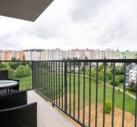 A balcony with a view of the Halalovka housing estate in Trenčín, at a 3-room apartment with outdoor seating.