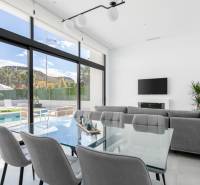 Bright living room with terrace and pool in the villa.