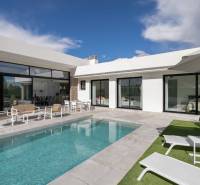 Villa in Calasparra with a pool, terrace, and comfortable outdoor seating under the blue sky.