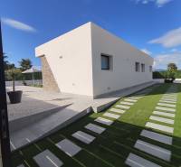 Villa in Calasparra with garden architecture, stone details, and manicured lawn.