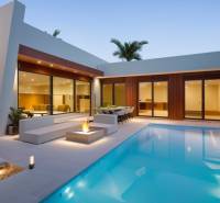 Villa in Calasparra, with a reflective pool, terrace, and garden evening lighting.