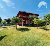 A family house in Trávnik with a large garden and simple architecture.