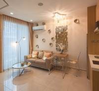Bright 2-room apartment with an open living room and a mirrored wall.