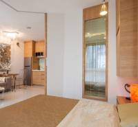 Interior of a 2-room apartment with a view of the living area and kitchen.