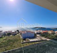 A view of seaside recreational apartments in Zečevo with a view of the sea and islands.