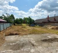 A plot in Chocholná-Velčice for residential purposes with a grassy area and auxiliary buildings.