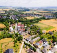 Aerial view of the village Chocholná-Velčice, surrounded by fields and residential land.
