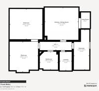 Floor plan of a family house with a kitchen, bedrooms, and a living area.