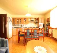 Kitchen with dining table and chairs in a family house.
