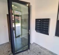 The entrance hall of an apartment building on Perlová Street in Bratislava - Jarovce with mailboxes.