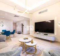 Living room in a 3-room apartment with a sofa, TV, and dining table.