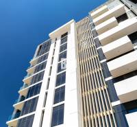 The facade of a modern apartment building in Bratislava - Staré Mesto with glass balconies.