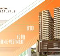 A building with modern design, Aurora Escalades logo, text 