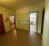 A room with light walls and parquet flooring in a 3-room apartment.