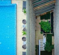 A view from above of the pool and terrace of apartment constructions in Pattaya.