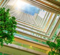 View from the atrium on the apartment construction, with the logo of 1BCR Real Estate Group.