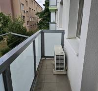 Balcony of a 2-room apartment on Žitavská Street in Senec with a railing and an air conditioning unit.