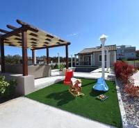 A family house in Bibinje with a gazebo, swimming pool, and lawn playground.