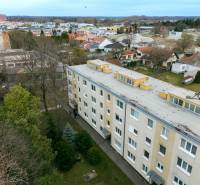 A view of the residential complex on Boriny Street, surrounded by family houses and greenery.