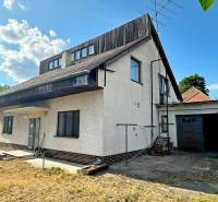 A family house on Komárňanská Street in Hurbanovo with a garage and yards.