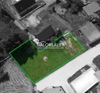 A plot for residential use in Malatíny, surrounded by buildings and nature, in a green boundary.