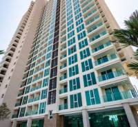 Construction of apartments in the city of Pattaya with a swimming pool and modern architecture.