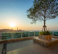Apartment construction in Pattaya with breathtaking views of the city and sunset.