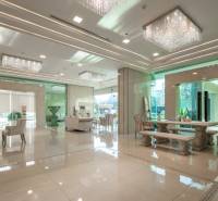 Luxurious entrance hall with marble floors and elegant furniture in the construction of apartments.