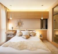 Beautiful bedroom with soft pillows in a 2-room apartment.