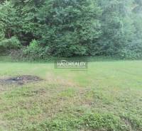 Plots - living in Modrová with grassy area and forest background for peaceful living.