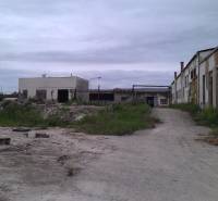 Abandoned warehouses and halls in Levice with deteriorated infrastructure and neglected surroundings.