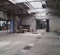 Industrial interior of warehouses and halls with workbenches and a forklift.