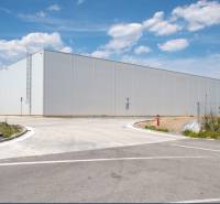 An industrial building in Bratislava - Devín, designated for warehouses and halls, surrounded by greenery.