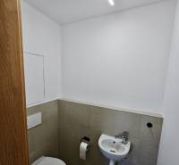 Bathroom in a 3-room apartment with a toilet and a small sink.