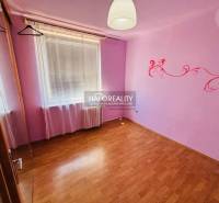 A children's room with purple walls and wall decorations in a 3-room apartment.