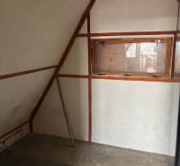 A cabin with a wooden structure, one window, part of the walls, ideal for recreational plots.