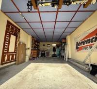 Garages used for storage and maintenance with various equipment and tools.