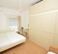 Bedroom in a 2-room apartment with a bed, wardrobe, and air conditioning.