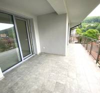 Spacious balcony with a view of the surrounding landscape in a 2-room apartment in Rajecké Teplice.