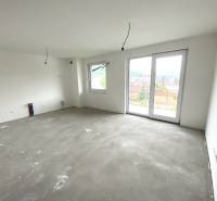 Unfurnished room in a 2-bedroom apartment with a large window and view.