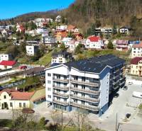 The image captures the surrounding houses and a new apartment complex on Nádražná Street.