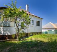 A family house on Gorazdova Street, Bratislava - Old Town, surrounded by greenery and a blue sky.