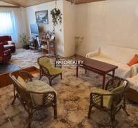 Interior of a family house with a cozy living space, carpets, and comfortable furniture.