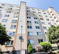 Apartment building on Hornádska Street in Bratislava with trees and parking.