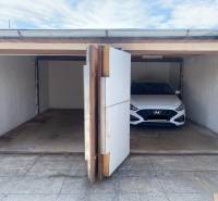 Two garages on Kolárska Street in Spišská Nová Ves, one empty.
