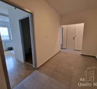 Hallway in a 4-room apartment with tiles, overlooking other rooms.