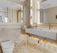 Luxury bathroom in a 3-room apartment with elegant marble decoration and a modern sink.
