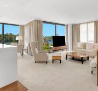 A bright living room with large windows and a view, 3-room apartment.