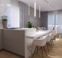 A bright kitchen in a 4-room apartment with a marble counter and a dining table.